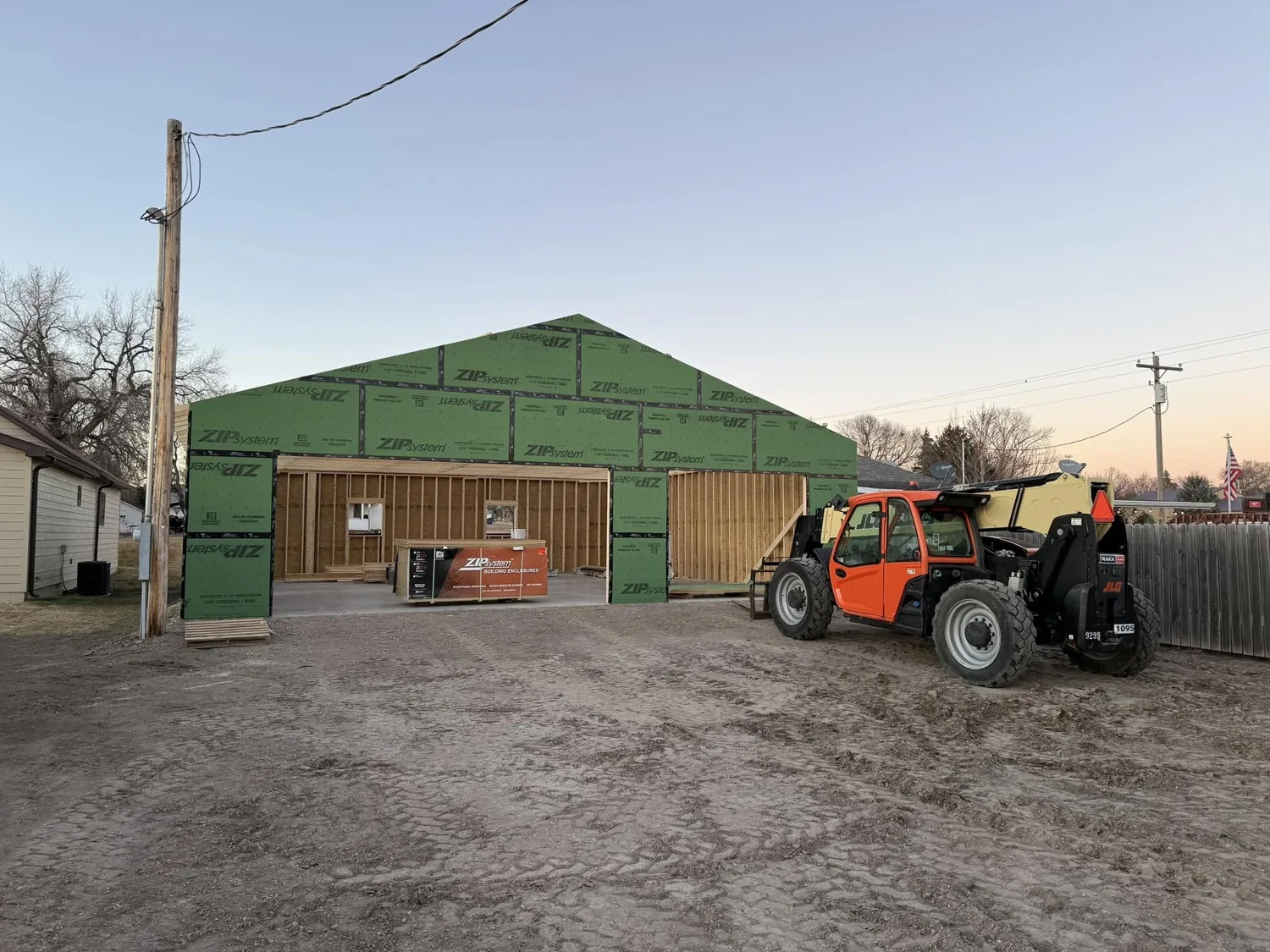 Garage build in progress — framing and sheathing