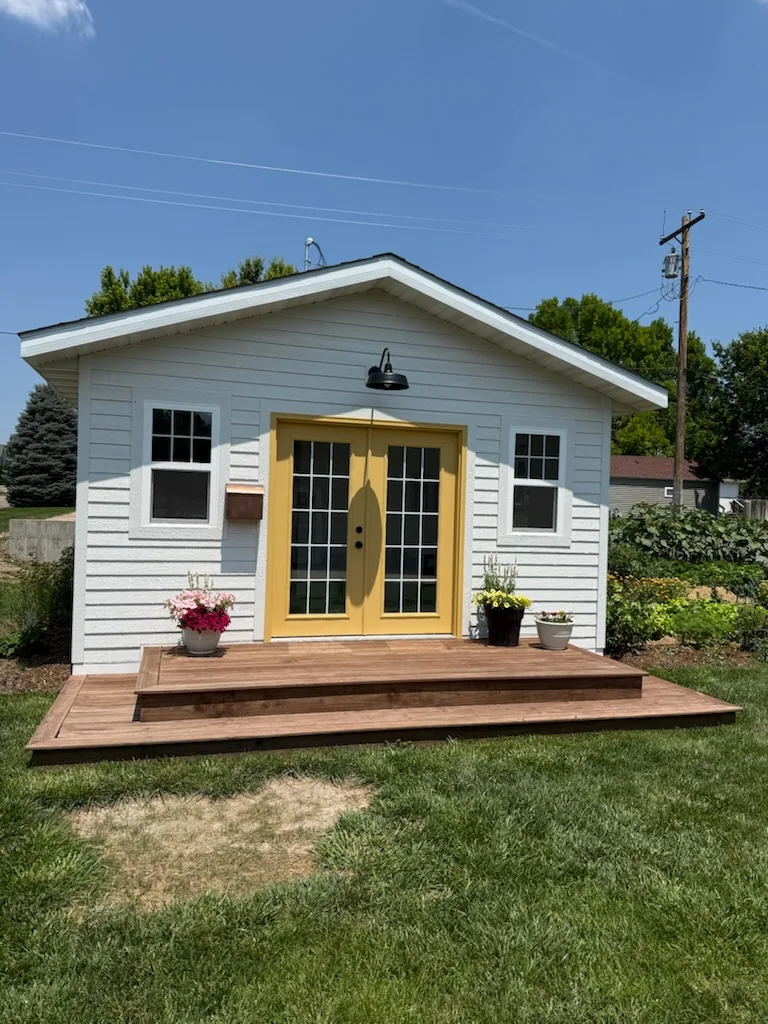 Custom studio build with cedar deck and French doors in Paxton, NE